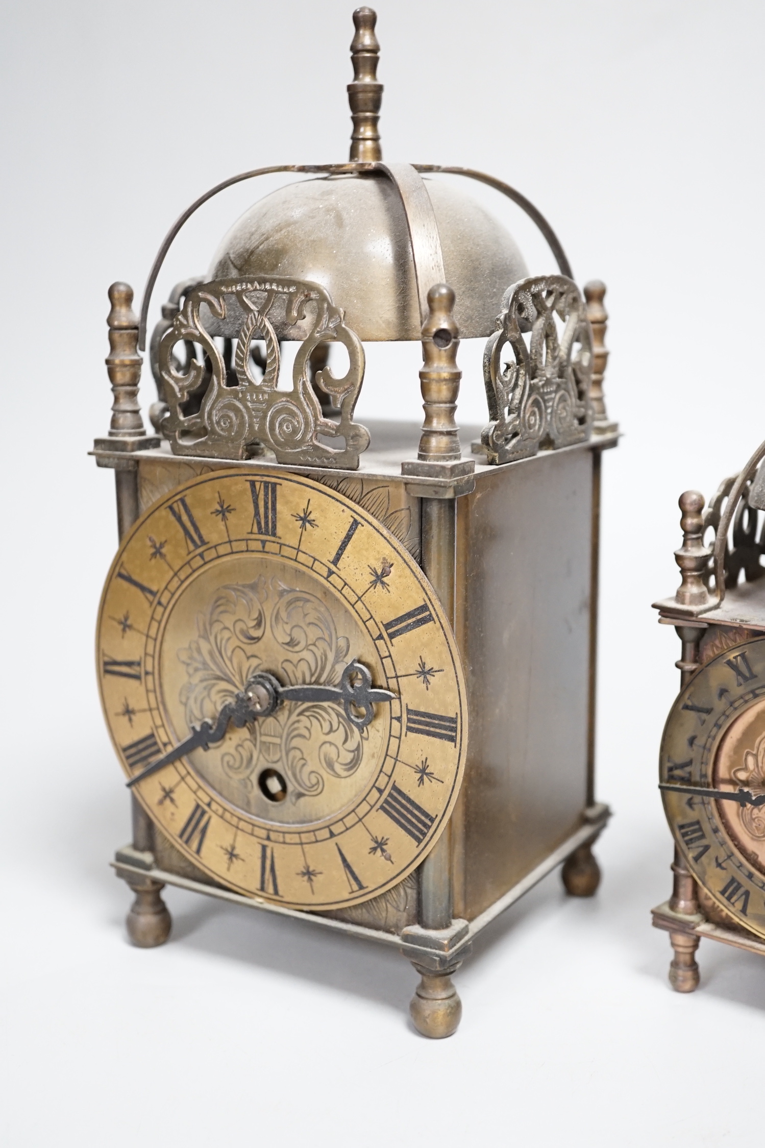 Two reproduction brass lantern clocks, tallest 24cm high